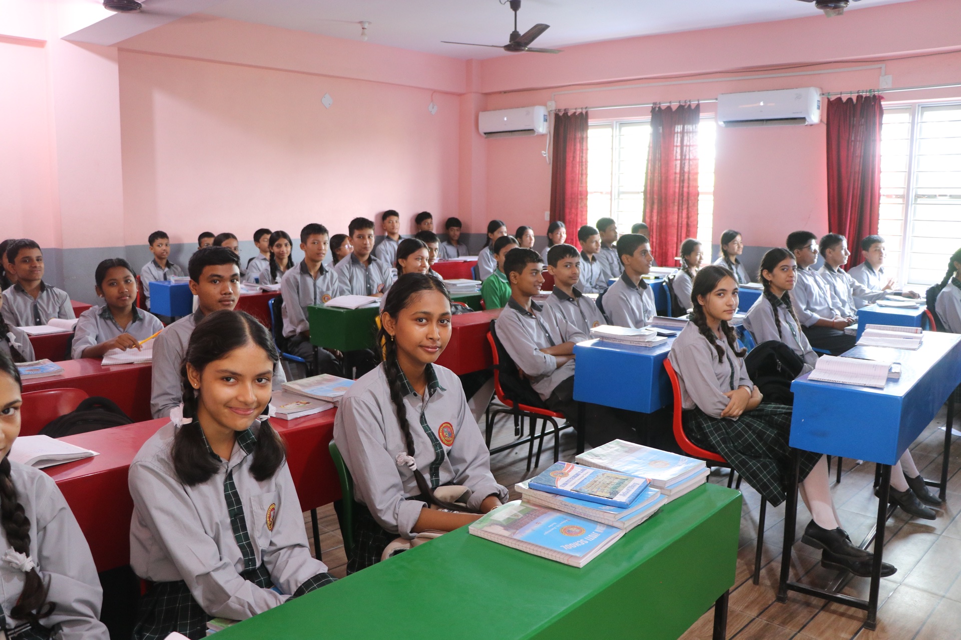 Students engaged in learning in air-conditioned classroom