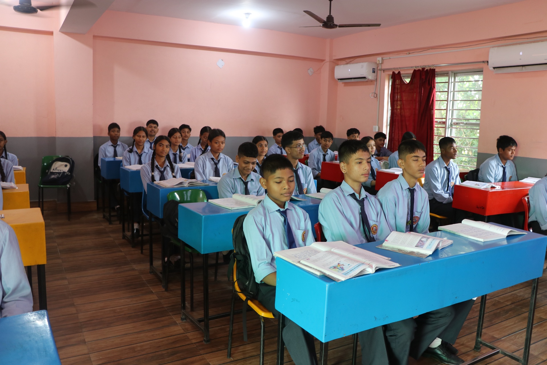 Teacher explaining curriculum concepts with headset microphone