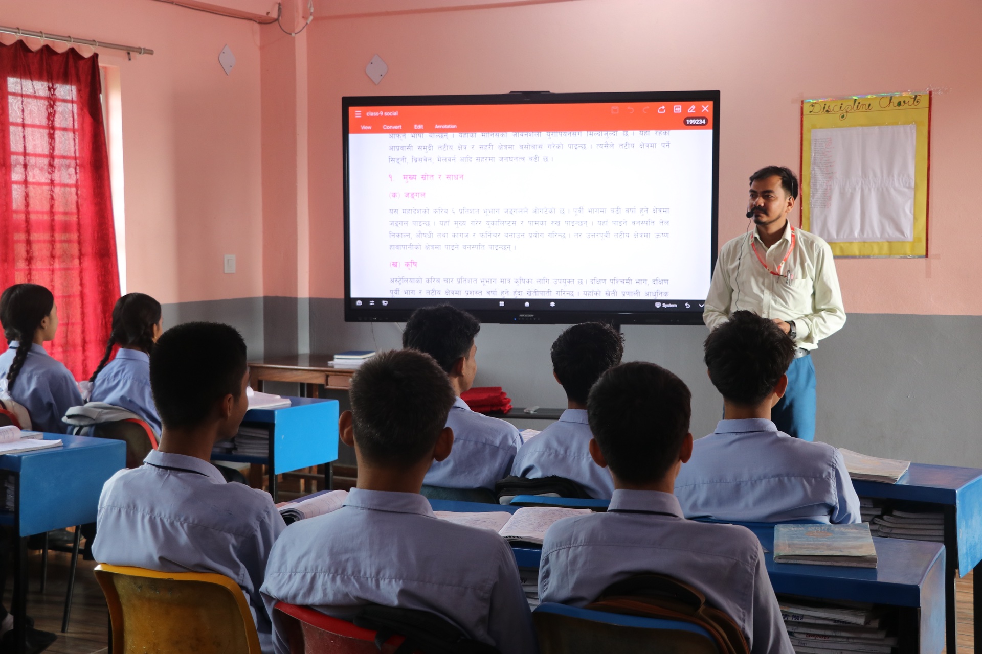 Class 9 students attending digital social studies presentation