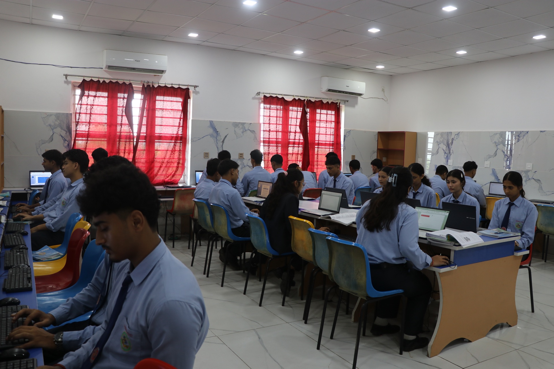 Students typing and browsing educational resources