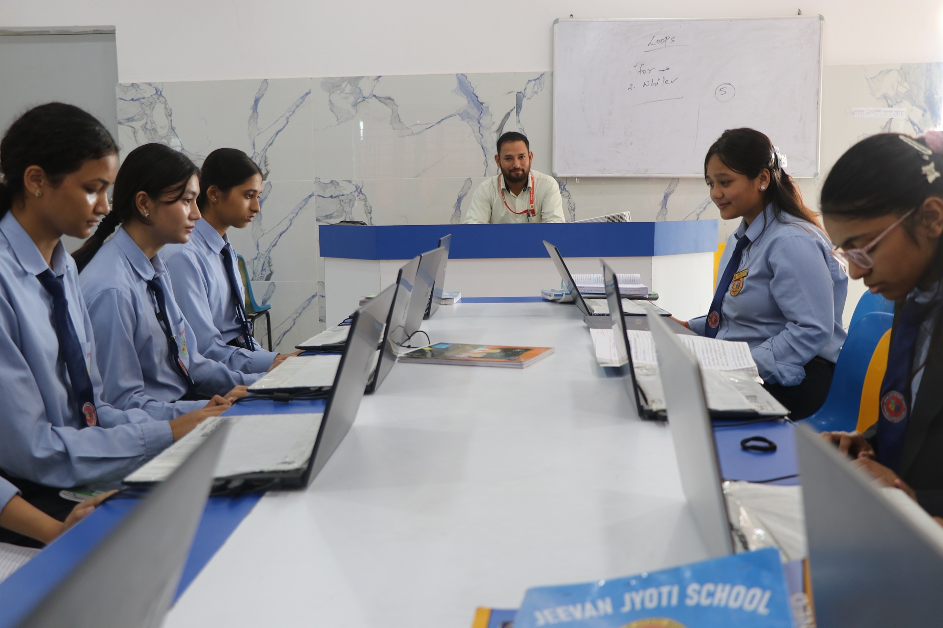 Spacious air-conditioned computer lab with individual systems