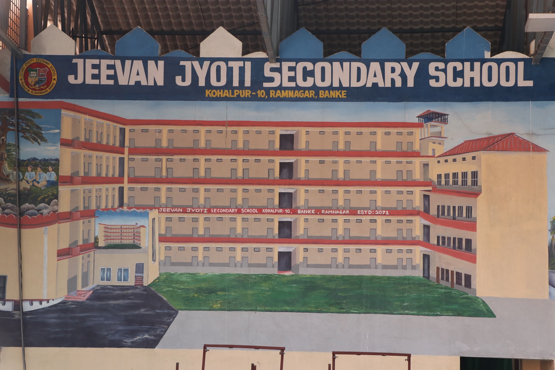 Mural of school building and emblem established in 2071 BS