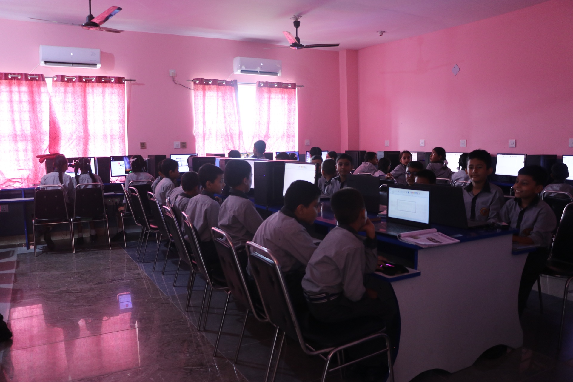 Junior school students learning computer fundamentals