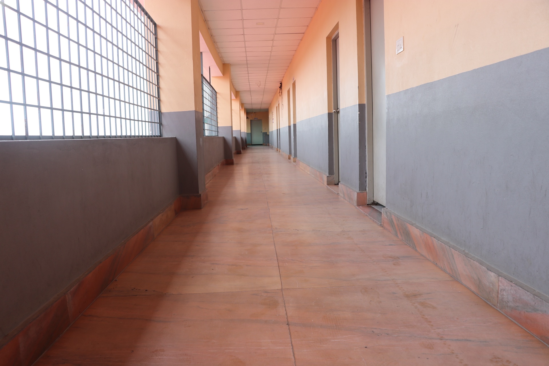 Wide upper floor hallway connecting smart classrooms