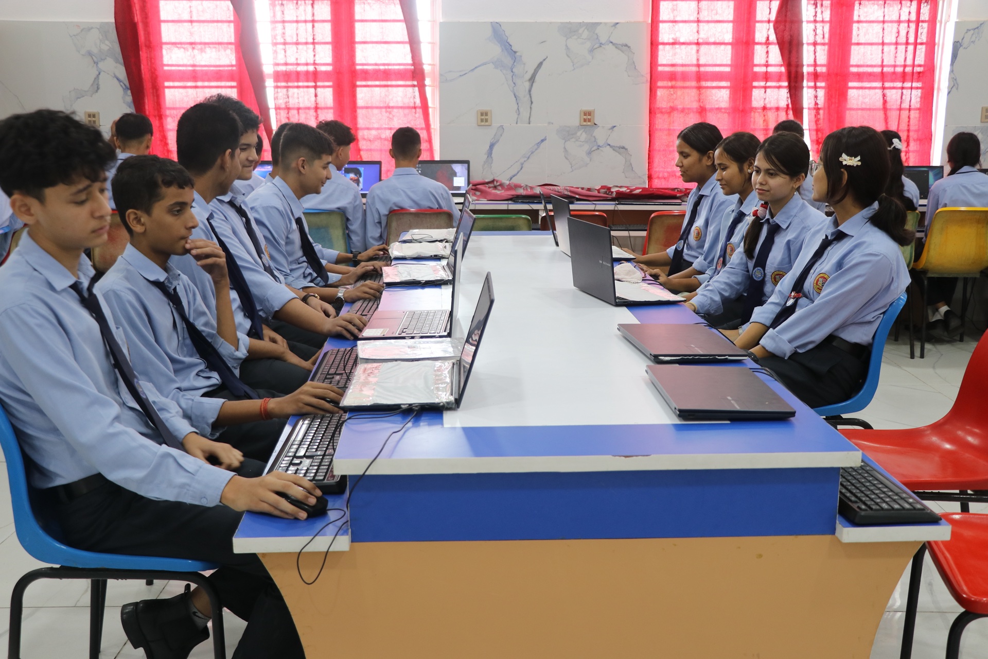 Students working simultaneously on computing assignments