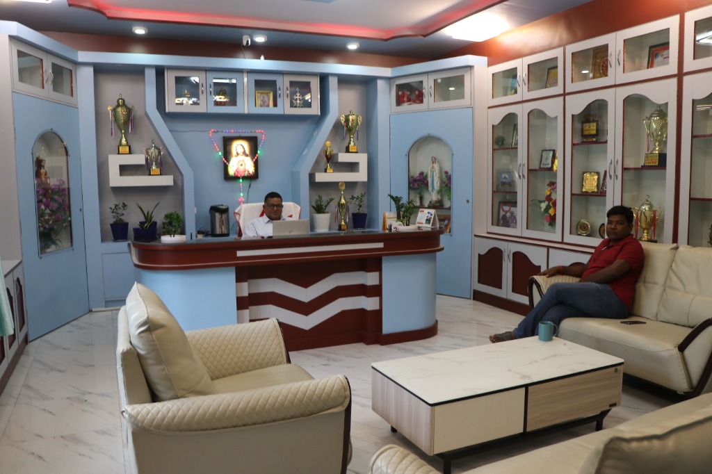 Principal executive office workspace and academic achievements display